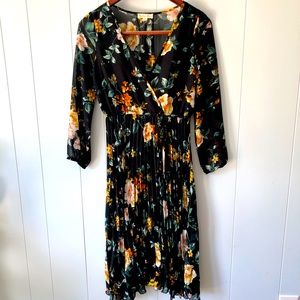 Adorable flirty dress with a V neckline. You’ll be date night ready!